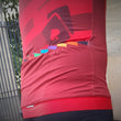 Load image into Gallery viewer, Rainbow of colours on cycling jersey close up on pockets