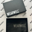 Load image into Gallery viewer, Black cycling arm warmers in wearwell packaging box